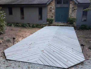 Before: Poor drainage and uneven grading near home foundation in Raleigh project by Fowler Outdoor Co.